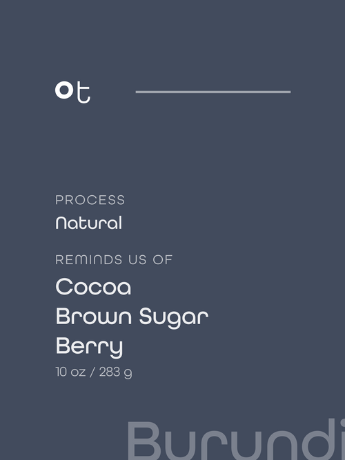 Dark slate blue package label with white text reading 'ot', 'PROCESS Natural', 'REMINDS US OF Cocoa Brown Sugar Berry', and '10 oz / 283 g'. A faint 'Brazil' watermark appears at the bottom right.